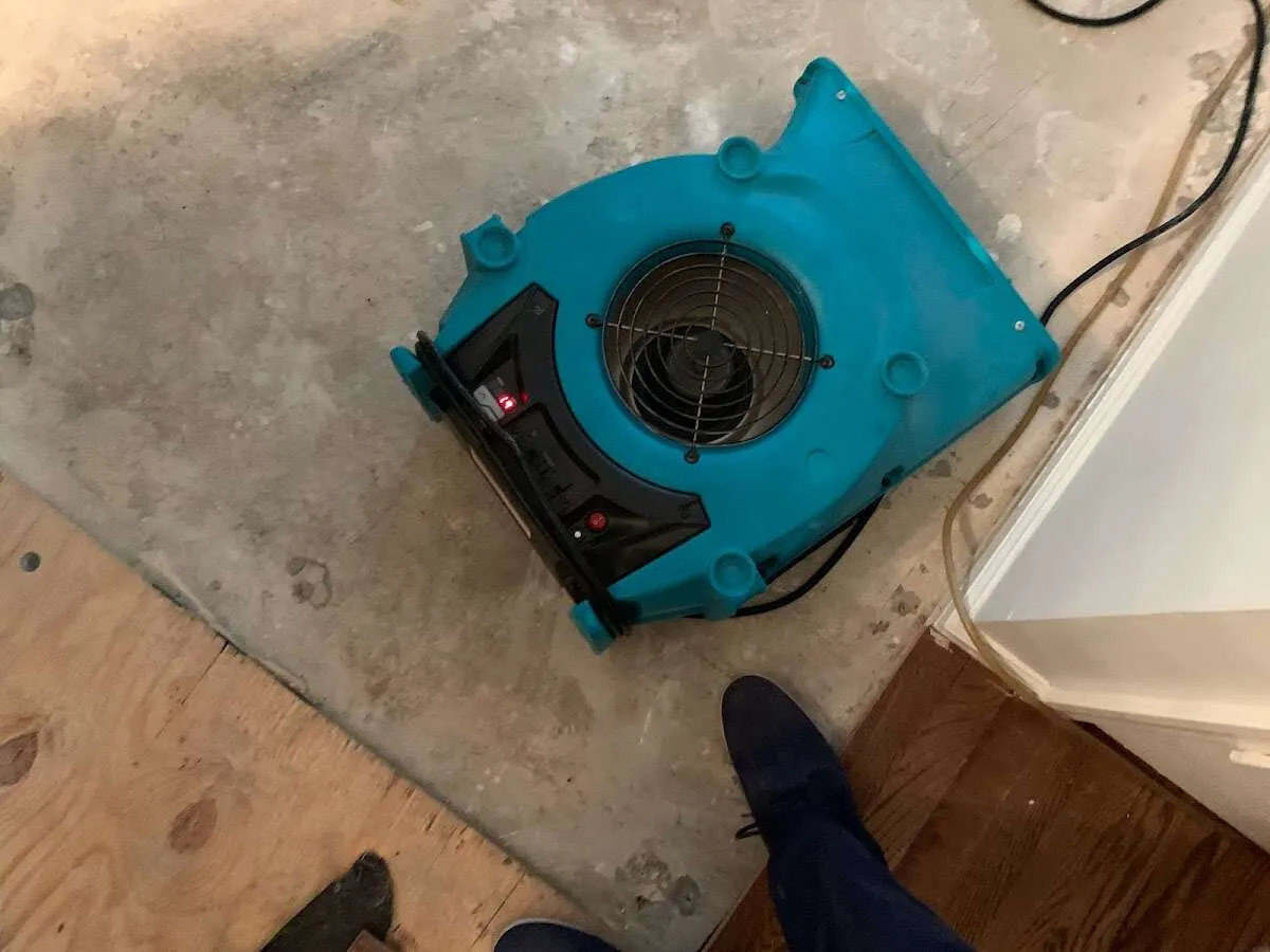 Air mover drying subfloor during Commercial Water Damage Restoration in Ladera Heights
